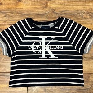 NWOT. Calvin Klein Black and White Striped and cropped Tee. Size L.